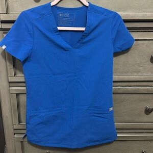size : xxs 
Color : Royal blue 
Brand : figs 
Casma Three-Pocket Scrub Top